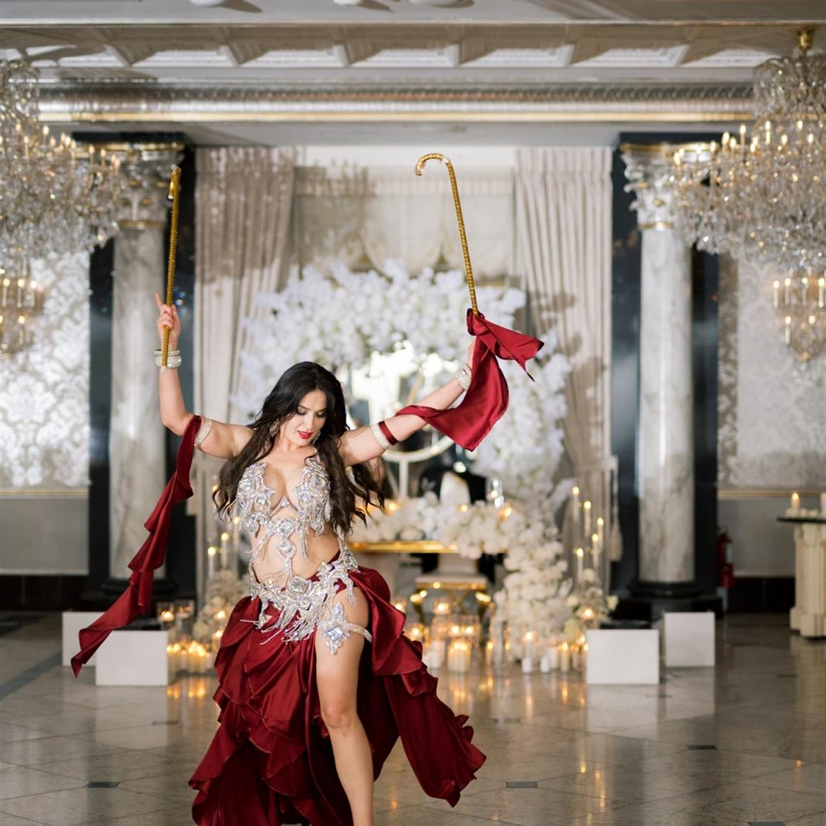 Dynamic Saidi cane dance with flowing red silk