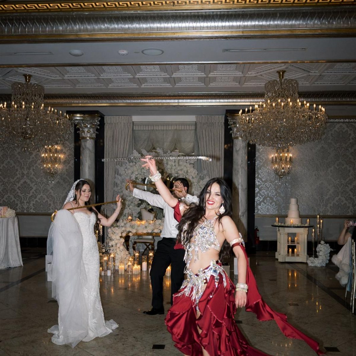 Wedding reception performance with bride, groom and golden canes